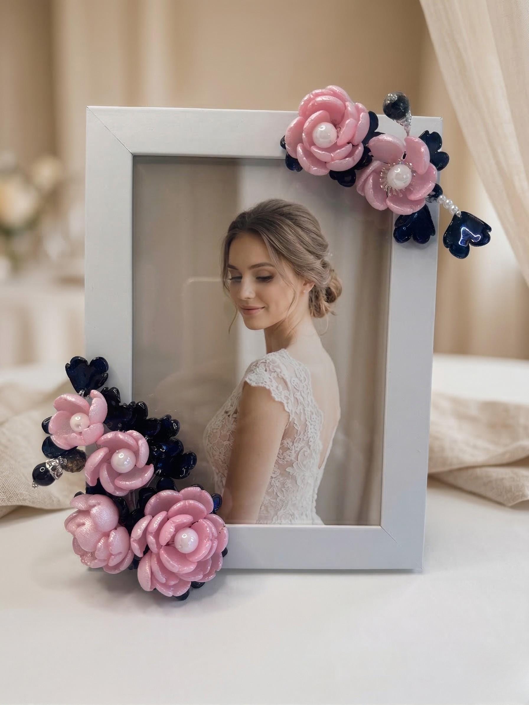 Blush pink and navy glass flowers on a white frame