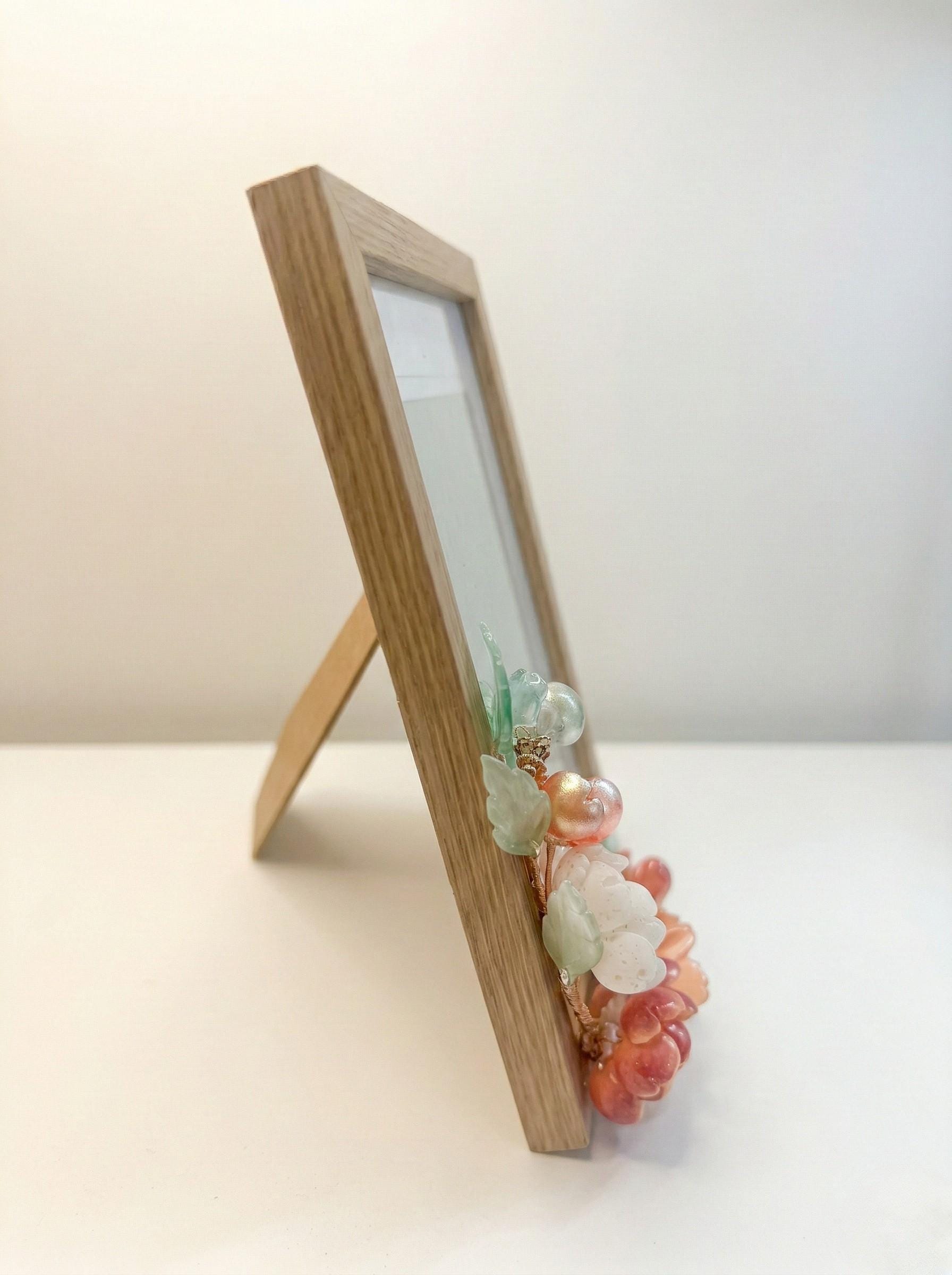 Glass flower picture frame in terracotta and amber tones