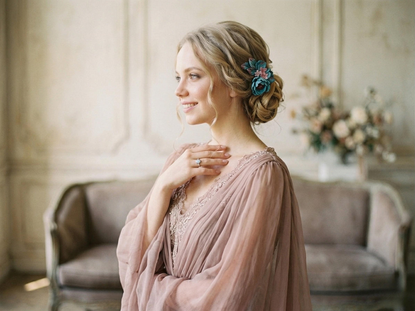 Model wearing the turquoise glass flower hairpiece