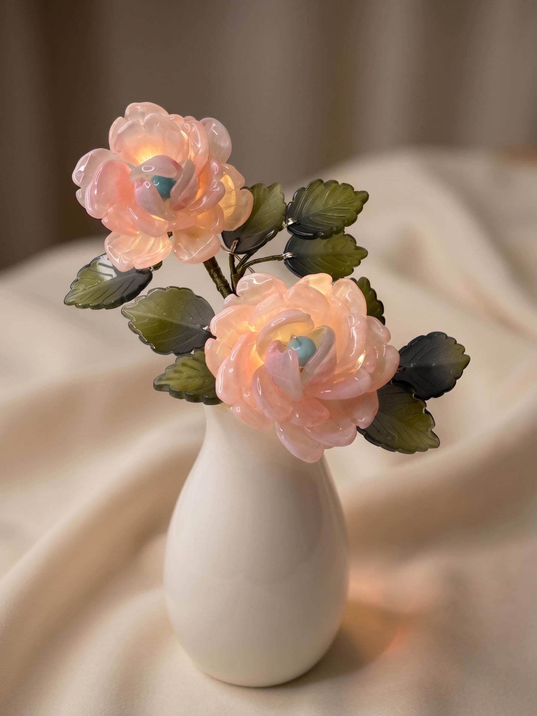 Pink glass rose lamp glowing warm LED light
