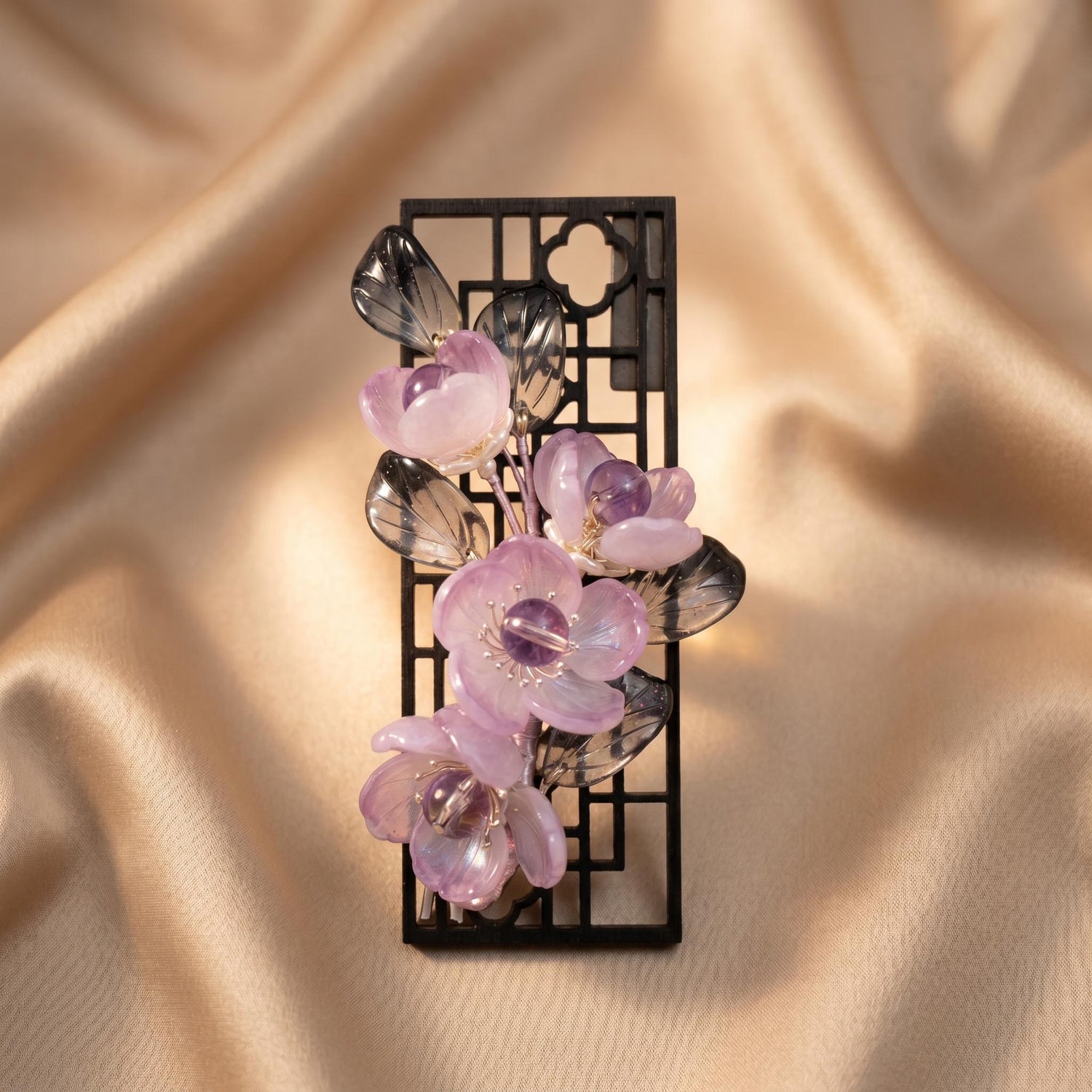 Amethyst glass flower fridge magnet on a black lattice frame, handmade in Sydney