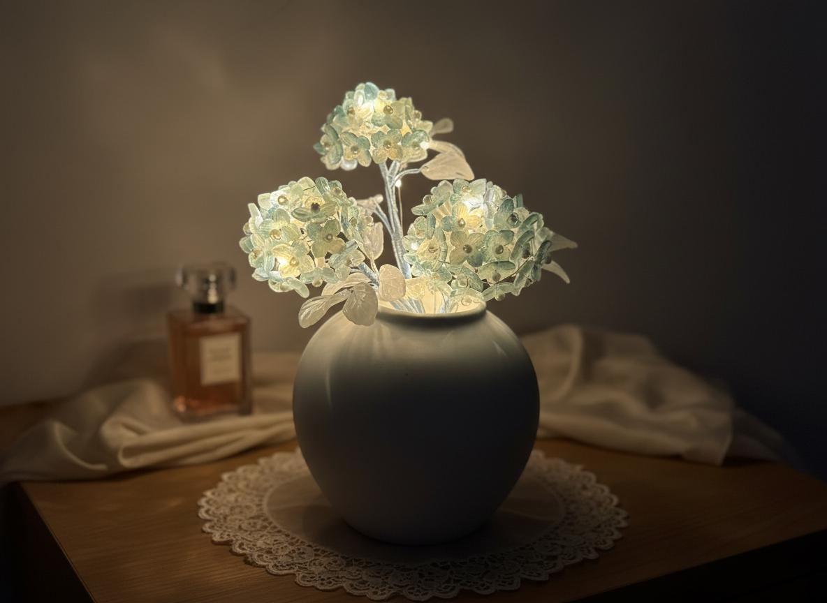 Blue glass hydrangea night light on bedside