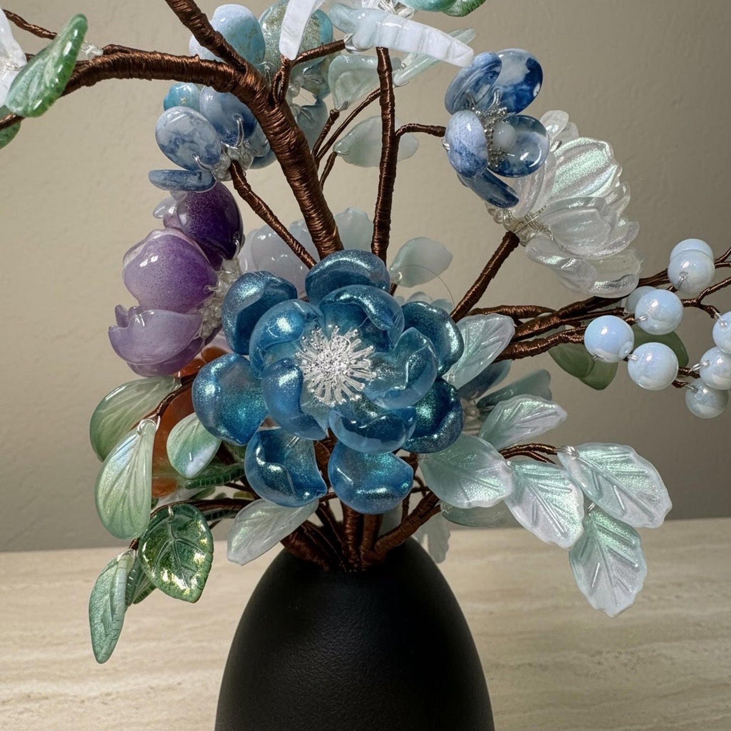 Glass flower bouquet styled on a console