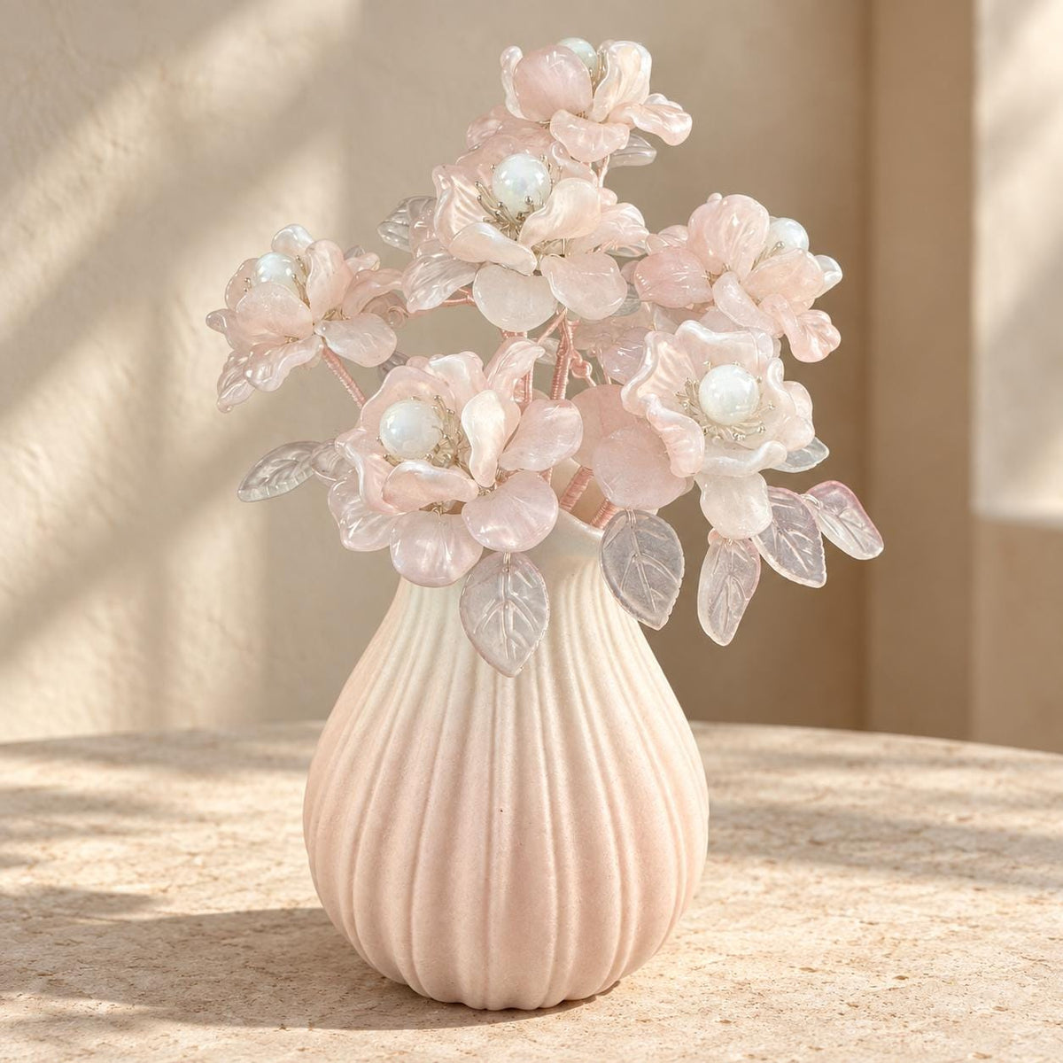 Blush-pink glass camellia blooms, front view