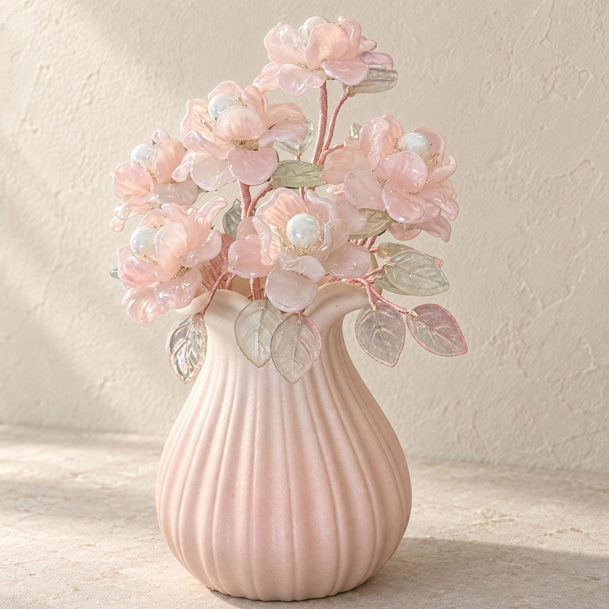 Pink glass camellia bouquet in a ribbed pale-pink ceramic vase, made in Sydney