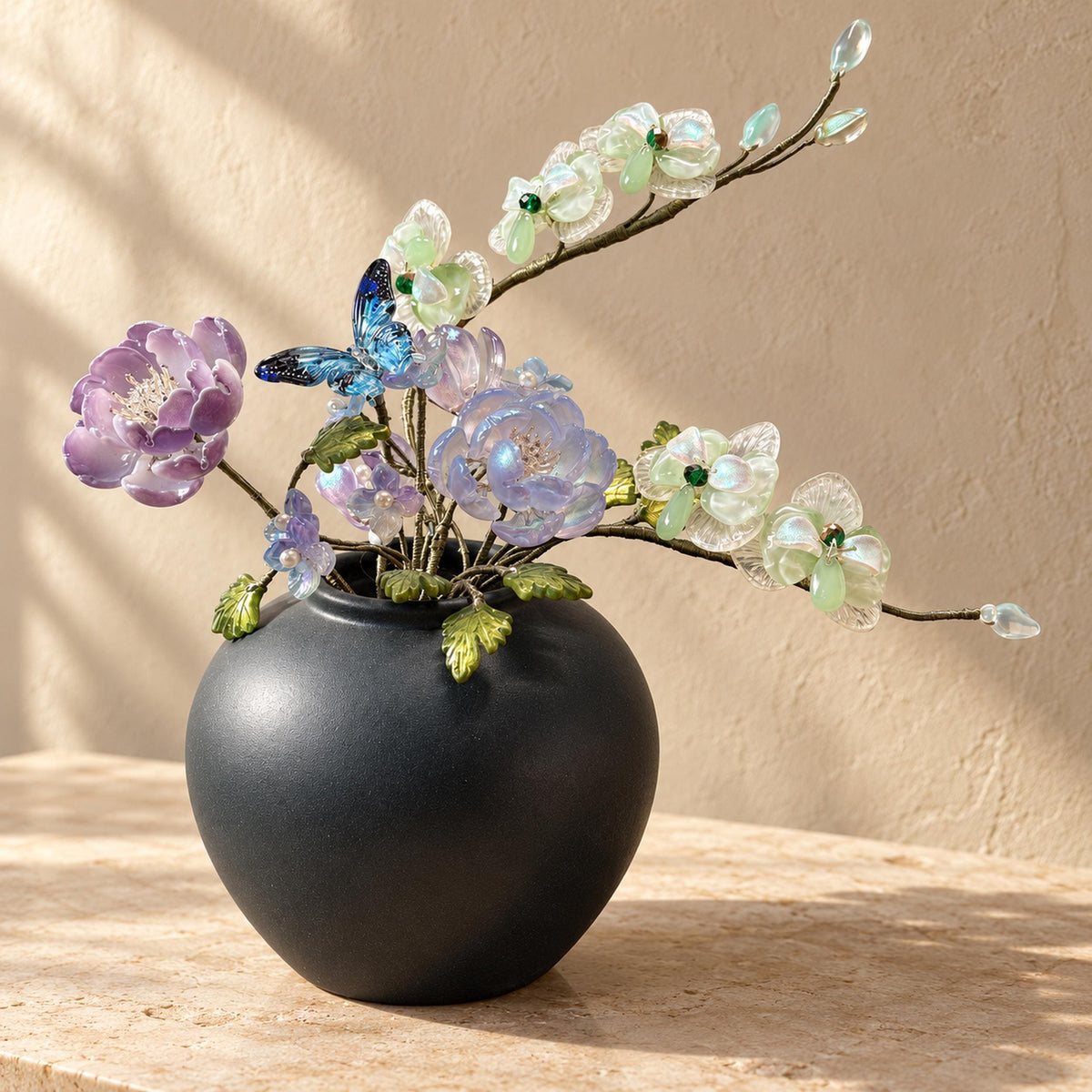 Butterfly orchid glass flower arrangement in dark ceramic vase